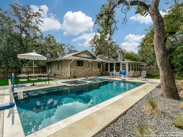 view of pool featuring an in ground hot tub and a patio