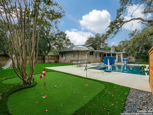 view of swimming pool with a patio area