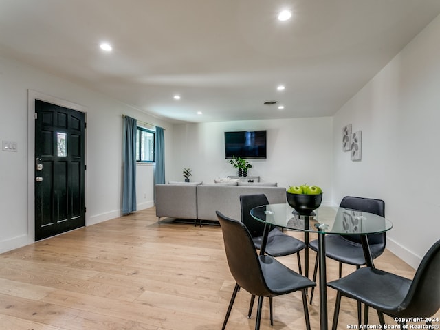 dining area with light hardwood / wood-style flooring