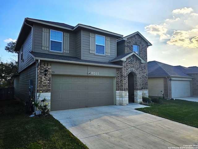 view of front property with a front yard and a garage