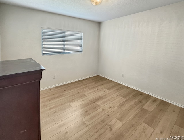 unfurnished room featuring light wood-type flooring