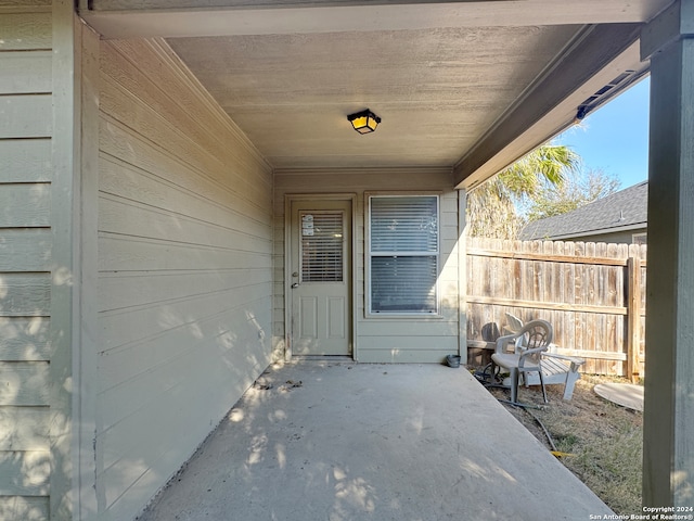 entrance to property with a patio area