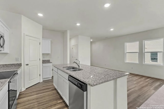 kitchen featuring white cabinetry, sink, hardwood / wood-style flooring, and stainless steel appliances