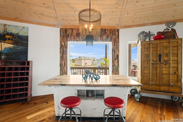 1517 S Magnolia St, Rockport, TX 78382 - dining room with wood finished floors, a chandelier, wood ceiling, vaulted ceiling, and baseboards