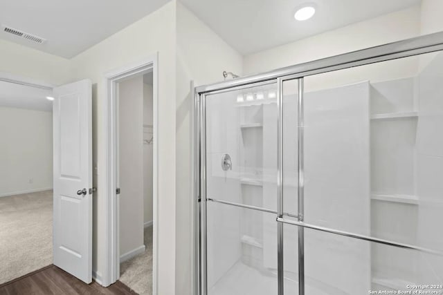 923 Middlebury Farms, San Antonio, TX 78221 - full bathroom featuring a shower stall, baseboards, and wood finished floors