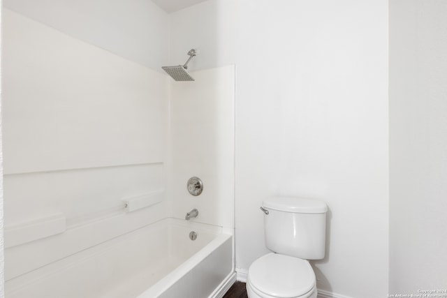 bathroom with toilet and tub / shower combination