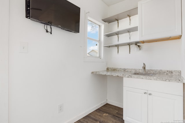 interior space with sink and dark wood-type flooring