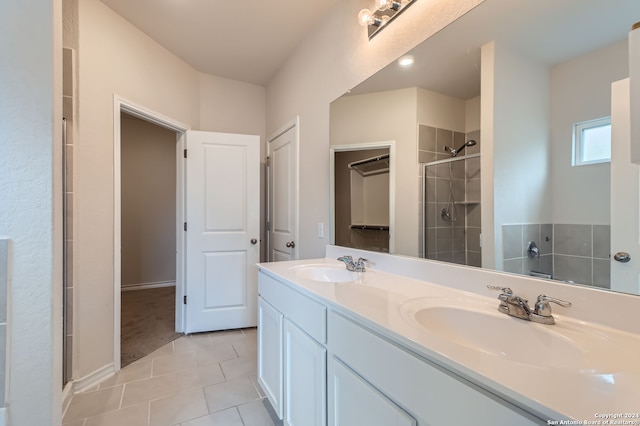 bathroom with vanity, walk in shower, and tile patterned floors