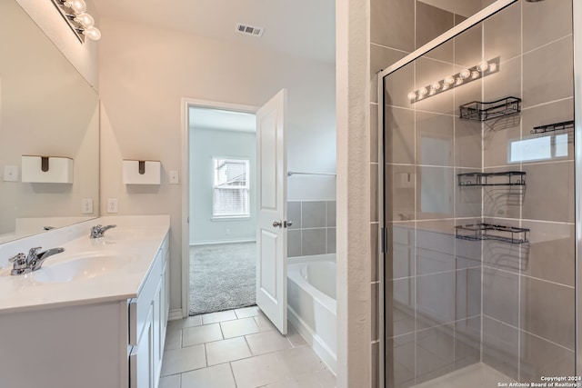 bathroom with vanity, independent shower and bath, and tile patterned floors