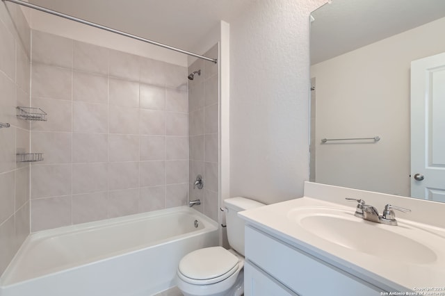 full bathroom featuring vanity, toilet, and tiled shower / bath