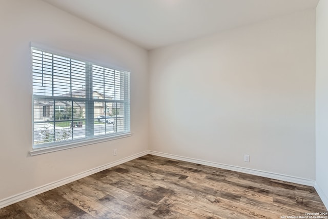 unfurnished room featuring wood-type flooring