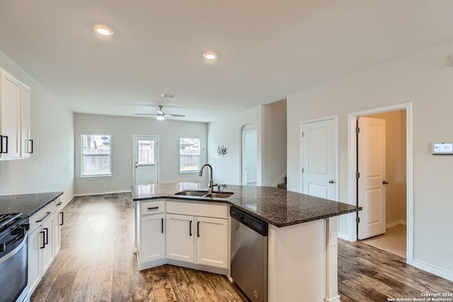 kitchen with white cabinets, sink, light hardwood / wood-style flooring, and stainless steel appliances