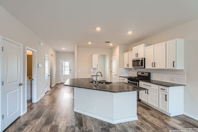 kitchen with white cabinets, hardwood / wood-style flooring, sink, and appliances with stainless steel finishes