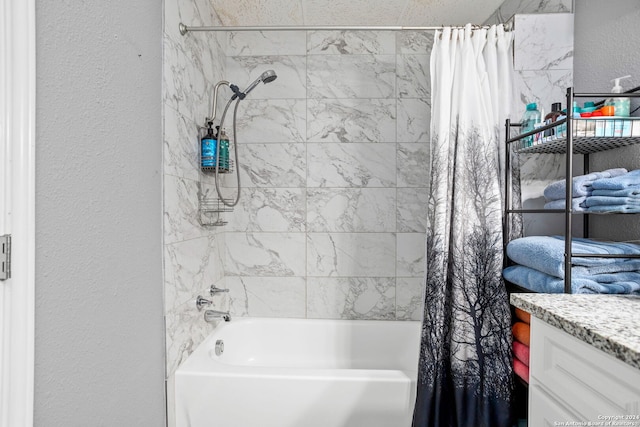 bathroom featuring vanity and shower / tub combo