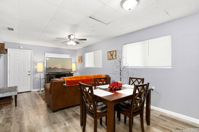 dining room with ceiling fan and wood-type flooring