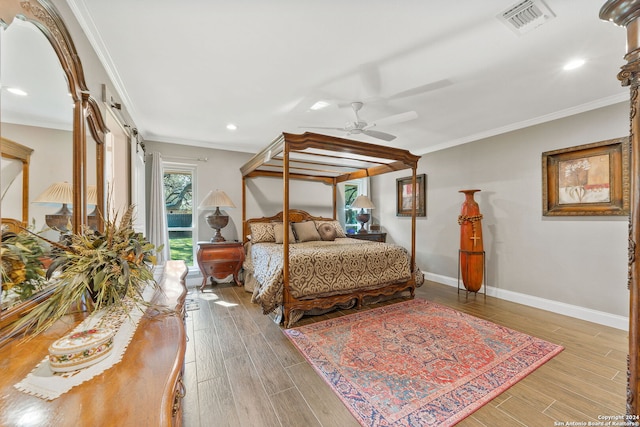 bedroom with ornamental molding, ceiling fan, and hardwood / wood-style flooring