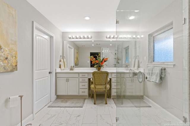 bathroom with vanity and an enclosed shower