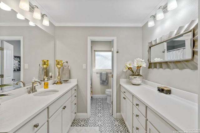 bathroom featuring vanity, toilet, crown molding, and tile patterned flooring