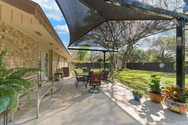 view of patio with a storage unit