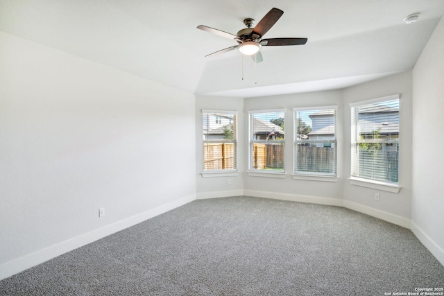 spare room featuring a ceiling fan, baseboards, and carpet flooring