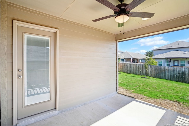 view of patio / terrace featuring fence and a ceiling fan