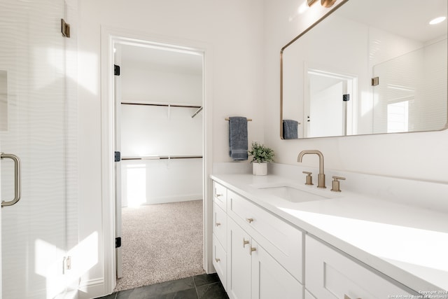 bathroom with vanity and an enclosed shower