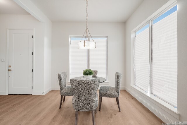 dining space with light wood-type flooring