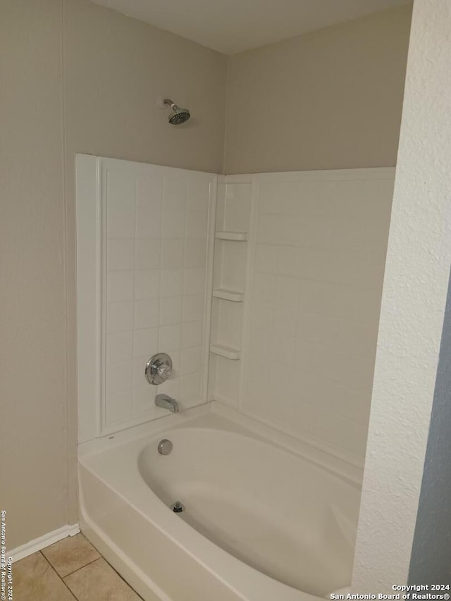 bathroom with tile patterned flooring and shower / bathing tub combination