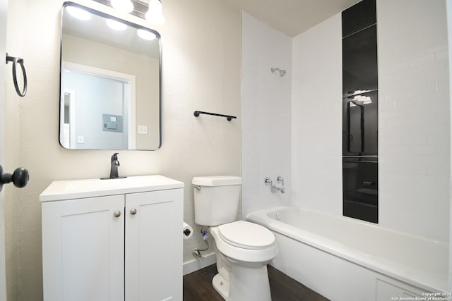 full bathroom with toilet, vanity,  shower combination, and hardwood / wood-style flooring