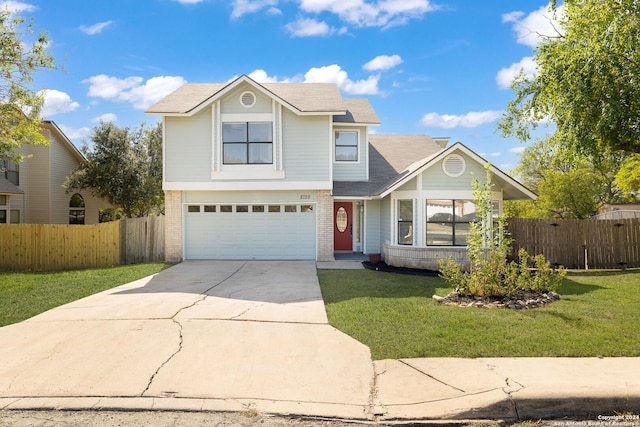 view of front property featuring a front yard and a garage