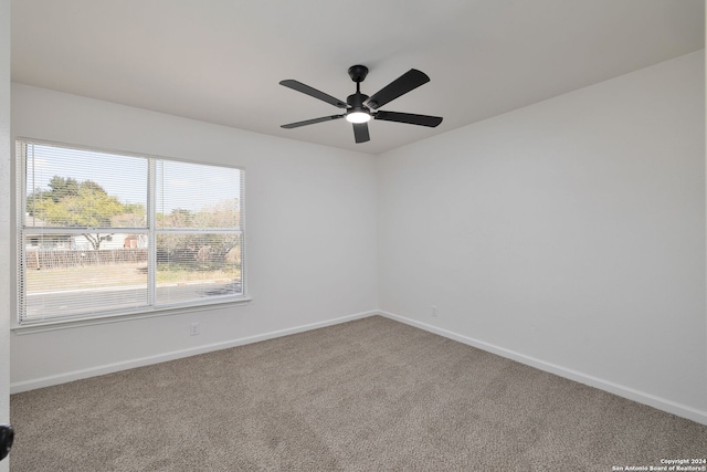 empty room with carpet floors and ceiling fan