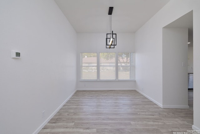 unfurnished dining area with light hardwood / wood-style floors