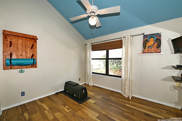 interior space featuring ceiling fan, dark wood-type flooring, and high vaulted ceiling