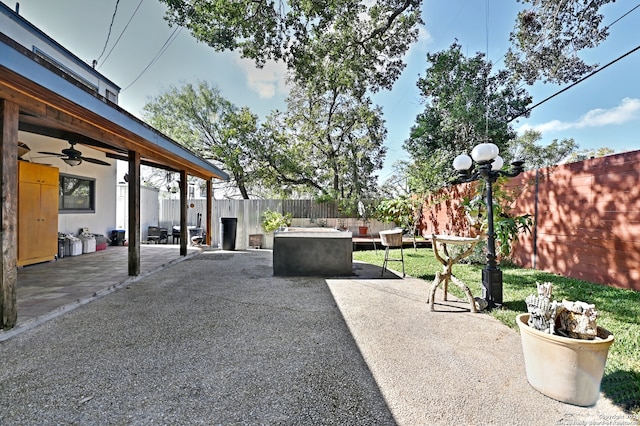 view of patio featuring ceiling fan