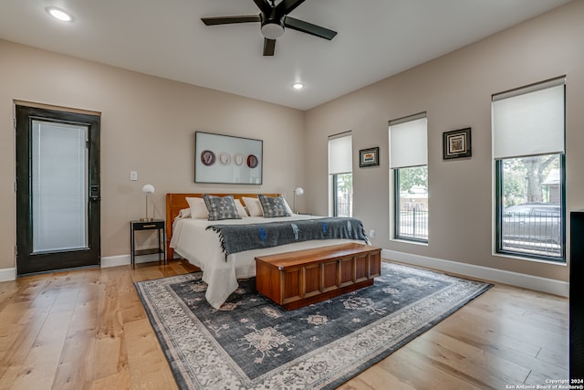 bedroom featuring light hardwood / wood-style flooring and ceiling fan