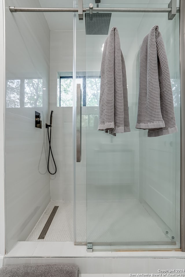 bathroom with an enclosed shower