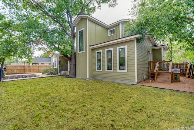 rear view of house with a lawn