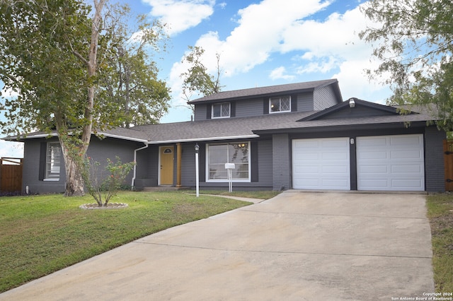 view of property with a front yard and a garage