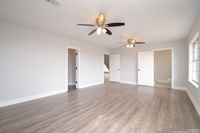 empty room featuring dark hardwood / wood-style floors and ceiling fan