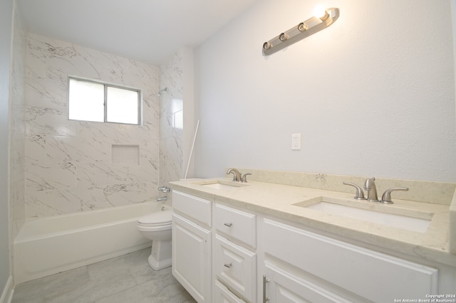 full bathroom featuring vanity, toilet, and tiled shower / bath