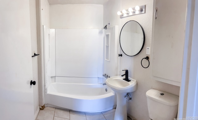 bathroom with tile patterned floors, toilet, and tub / shower combination