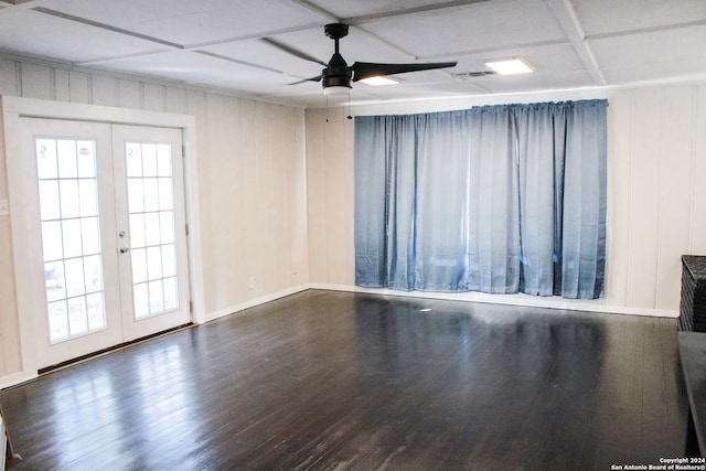 unfurnished room featuring coffered ceiling, ceiling fan, hardwood / wood-style floors, and french doors