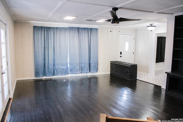 unfurnished room with dark hardwood / wood-style floors and ceiling fan