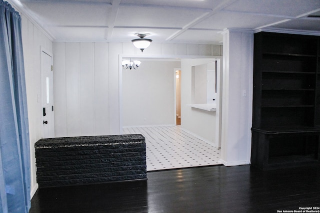 interior space featuring coffered ceiling and dark hardwood / wood-style floors