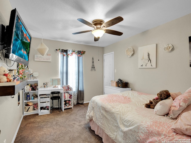 bedroom featuring ceiling fan, carpet floors, and a textured ceiling