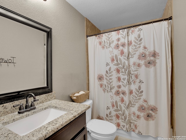 bathroom featuring vanity, a textured ceiling, toilet, and a shower with shower curtain