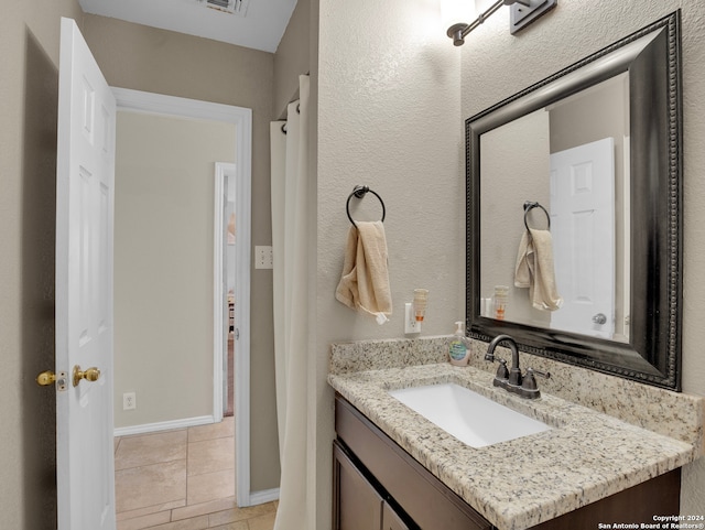 bathroom featuring vanity and tile patterned floors