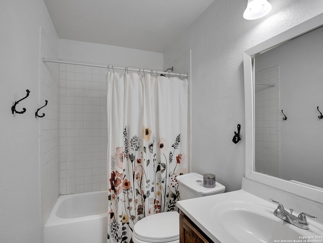 full bathroom featuring shower / tub combo, vanity, and toilet