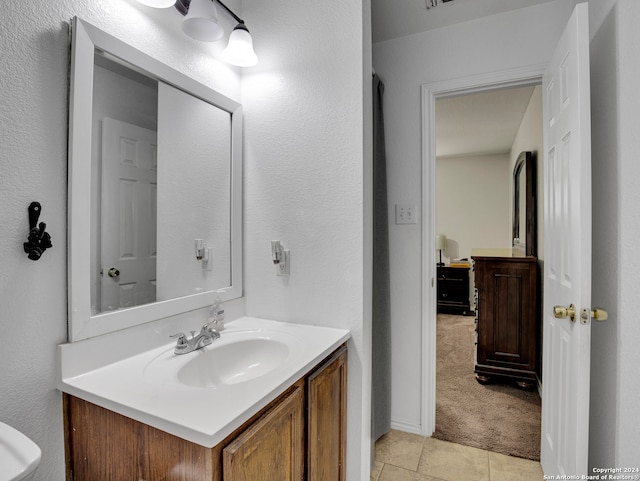 bathroom with vanity and tile patterned floors