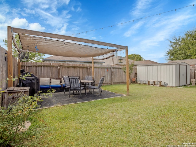 view of yard featuring a storage shed and a patio area